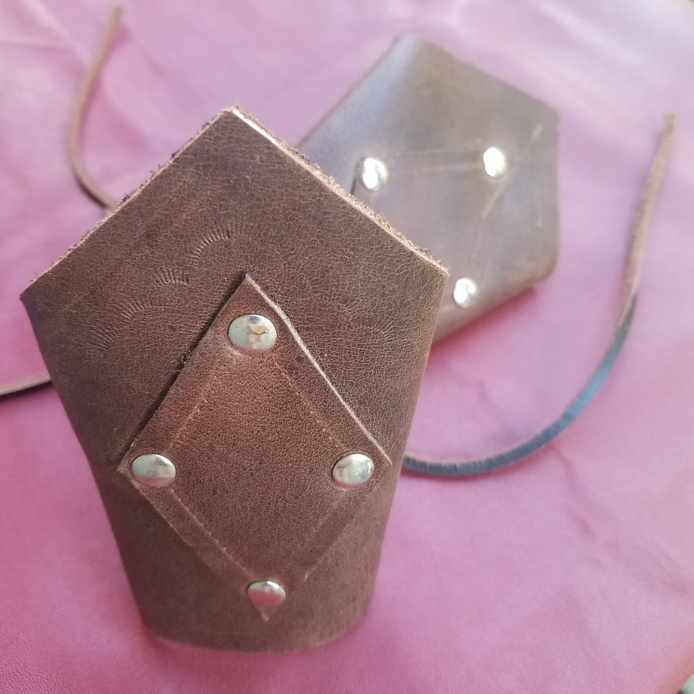 100% leather arm bracers